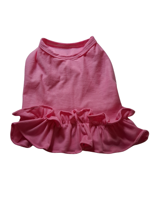 Pink dog dress with ruffled skirt on a white background